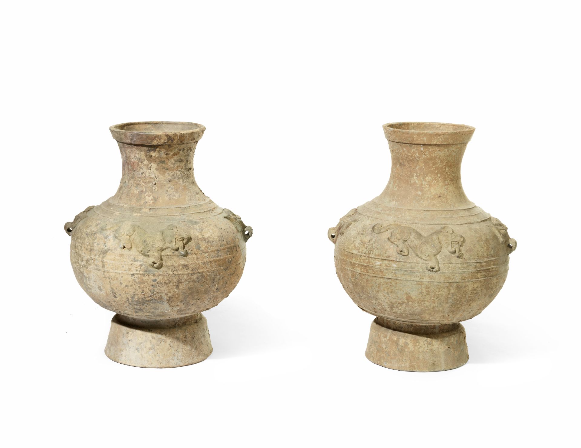 TWO LARGE RELIEF-MOULDED HAN-STYLE JARS (2)
