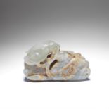 A PALE GREEN AND RUSSET JADE 'MANDARIN DUCKS' CARVING 17th/18th century