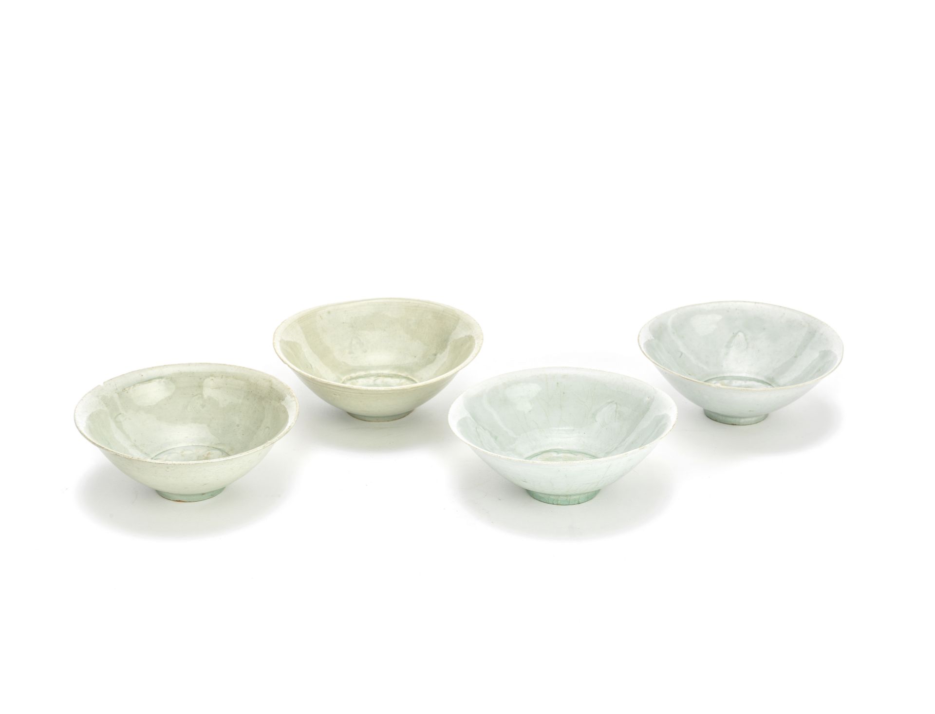 A GROUP OF FOUR QINGBAI 'PEONY' BOWLS Song Dynasty (4)