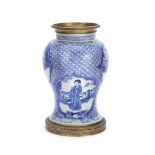 A GILT METAL-MOUNTED BLUE AND WHITE BALUSTER VASE The porcelain Kangxi