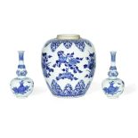 A BLUE AND WHITE FLORAL JAR AND A PAIR OF TRIPLE GOURD VASES Kangxi (3)