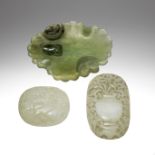 TWO PALE GREEN JADE RUYI PLAQUES AND A SERPENTINE CARVED DISH 19th century (3)