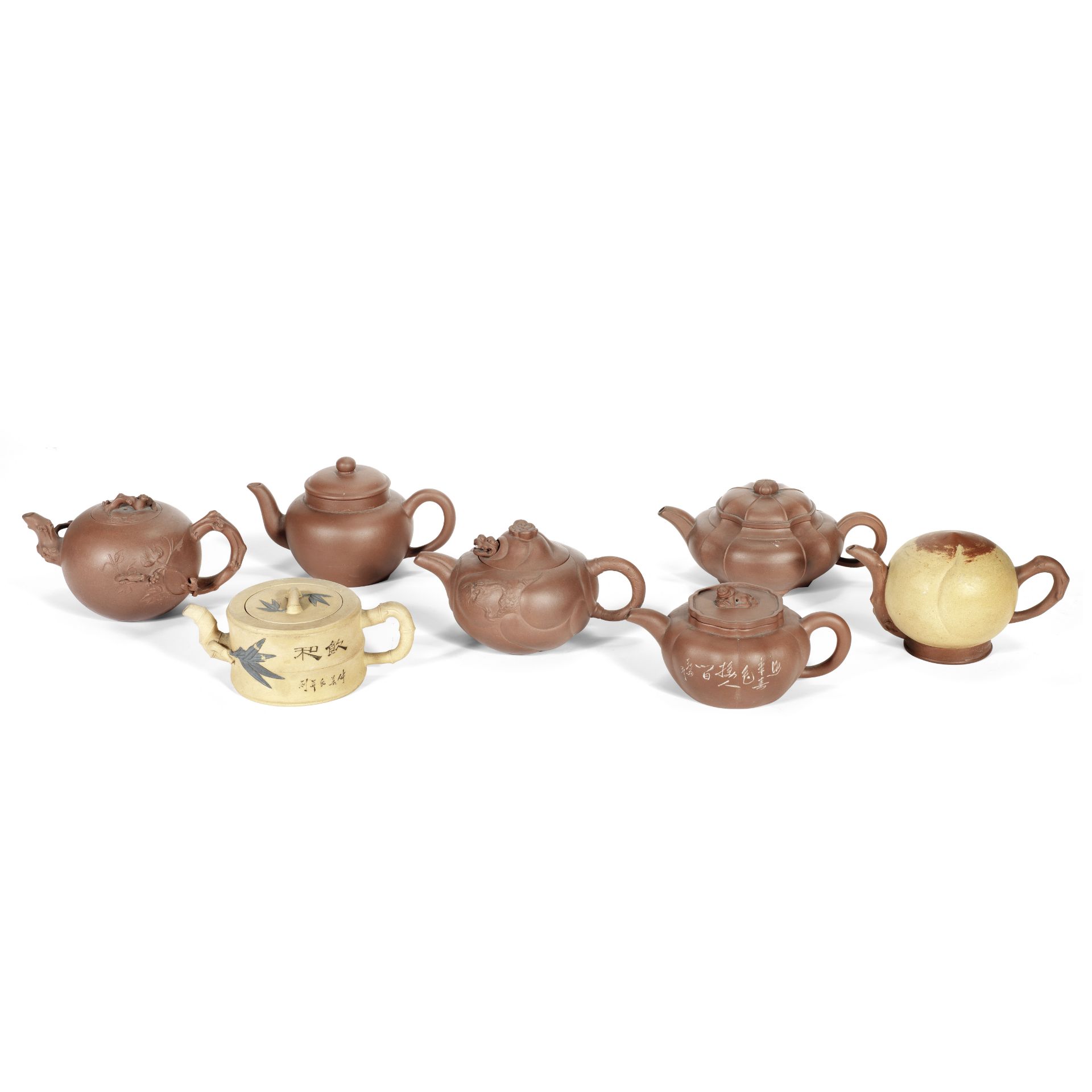 A GROUP OF SEVEN YIXING TEAPOTS AND COVERS Late Qing Dynasty/Republic Period (13)