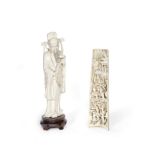 AN IVORY CARVING OF A SCHOLAR AND A CARVED IVORY WRIST REST 19th century (2)