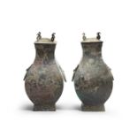 A PAIR OF ARCHAIC BRONZE RITUAL WINE VESSELS AND COVERS, FANGHU Han Dynasty (4)