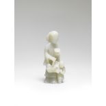 A RARE VERY PALE GREEN JADE 'LADY AND BOY' GROUP Kangxi