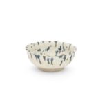 A CREAM-GLAZED BLUE-SPLASHED BOWL Tang Dynasty