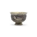 A RARE PARCEL-GILT SILVER-ALLOY REPOUSS&#201; CUP Song Dynasty