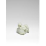 A PALE GREEN JADE 'DOUBLE RAM' GROUP 17th/18th century