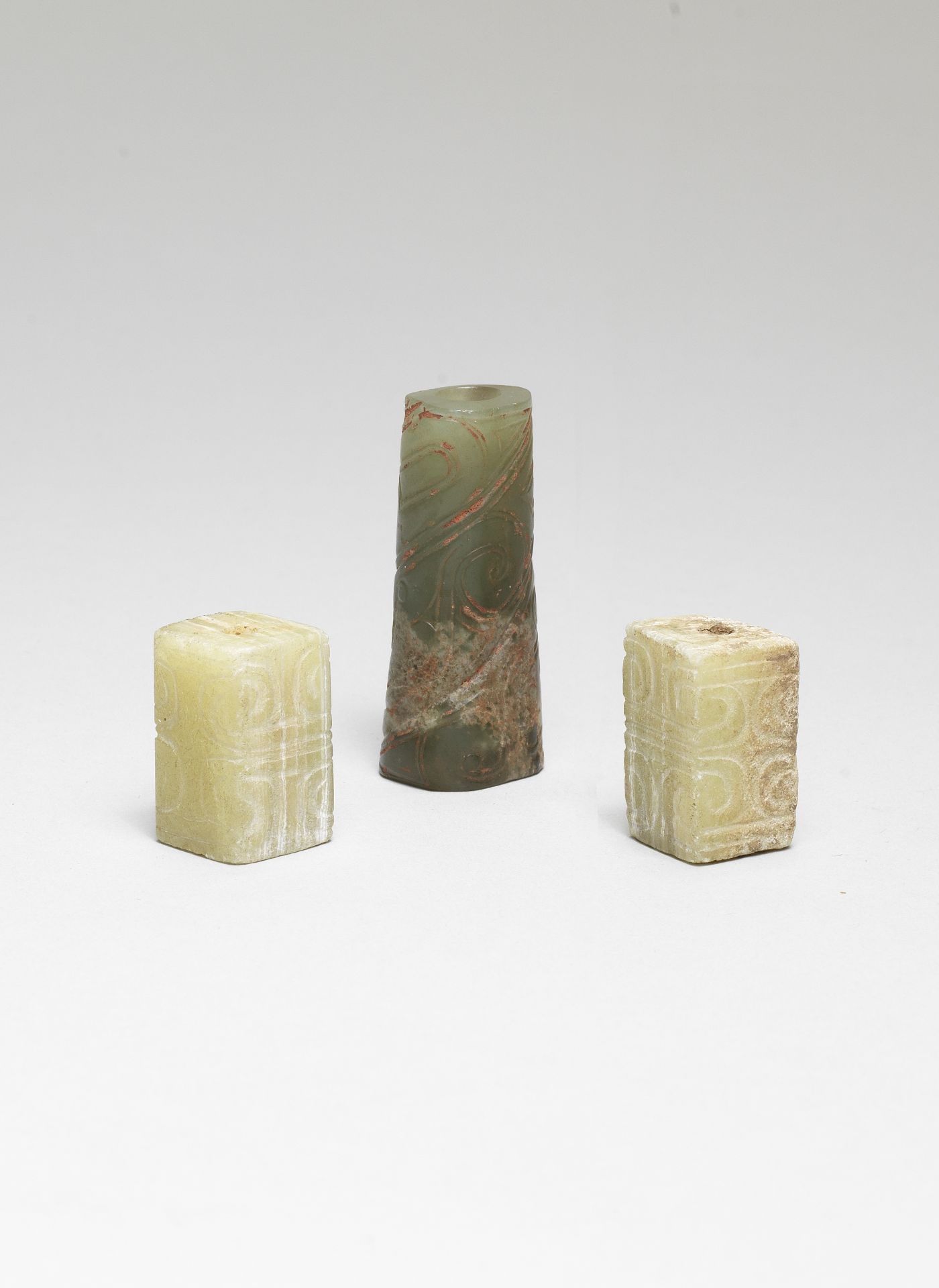 AN ARCHAIC JADE BEAD AND TWO HARDSTONE BEADS Zhou Dynasty (5)