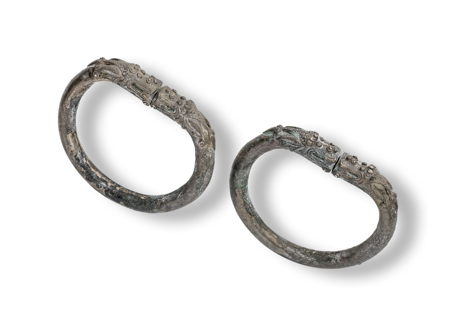 A PAIR OF SILVER-ALLOY 'DOUBLE DRAGONS' BANGLES 17th century (2)