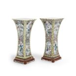 A RARE PAIR OF LARGE FAMILLE ROSE 'ROMANCE OF THE WESTERN CHAMBER' VASES AND STANDS, GU Yongzheng...