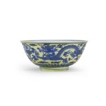 A RARE AND FINE YELLOW-GROUND BLUE AND WHITE 'DRAGON AND RUYI' BOWL Kangxi six-character mark and...