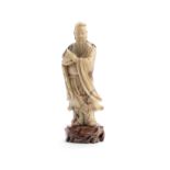 A RARE SOAPSTONE FIGURE OF DONGFANG SHUO Signed Suo Yun, 18th century (2)