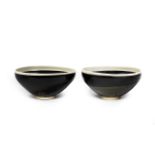 A PAIR OF BLACK-GLAZED WHITE-RIMMED BOWLS Song/Jin Dynasty (3)