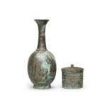 A BRONZE RIBBED BOX AND COVER AND A BRONZE BOTTLE VASE Tang Dynasty (3)