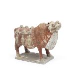 A PAINTED POTTERY MODEL OF AN OX Tang Dynasty