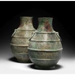 A RARE PAIR OF ARCHAIC BRONZE RITUAL WINE VESSELS, HU Warring States Period (2)