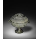 AN ARCHAIC BRONZE RITUAL FOOD VESSEL AND COVER, DOU Eastern Zhou Dynasty