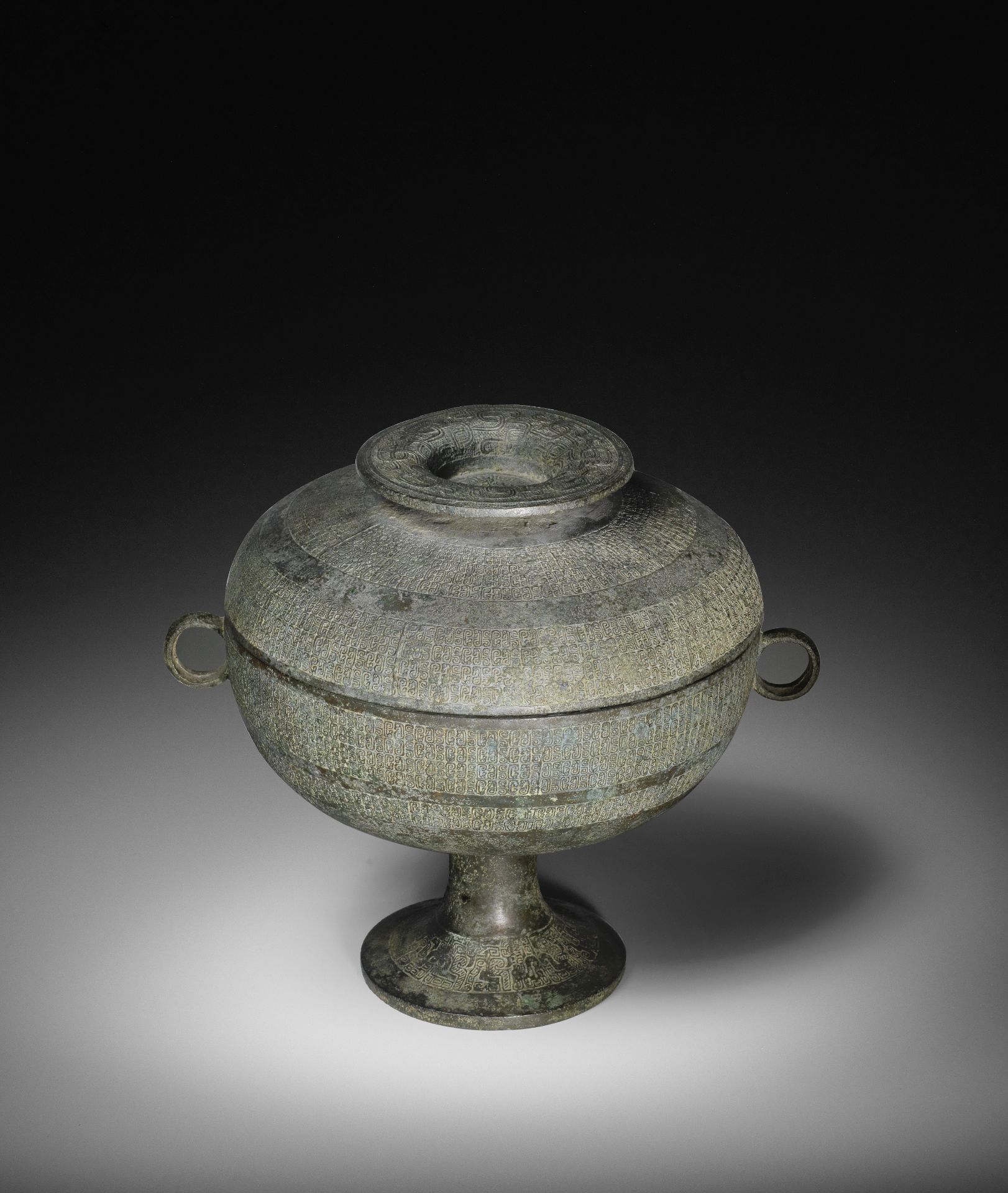 AN ARCHAIC BRONZE RITUAL FOOD VESSEL AND COVER, DOU Eastern Zhou Dynasty