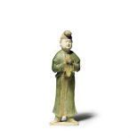 A RARE AND LARGE SANCAI-GLAZED POTTERY FIGURE OF A MALE ATTENDANT Tang Dynasty