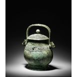 A VERY RARE ARCHAIC BRONZE RITUAL WINE VESSEL AND COVER, YOU Early Western Zhou Dynasty, 10th cen...