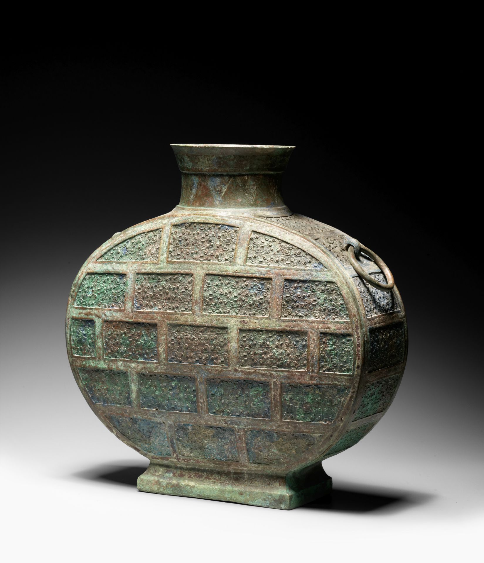 A VERY RARE ARCHAIC BRONZE COPPER-INLAID WINE VESSEL, BIANHU Warring States Period