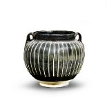 A BLACK-GLAZED 'RIBBED' JAR Northern Song/Jin Dynasty