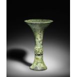 A VERY RARE ARCHAIC BRONZE RITUAL WINE VESSEL, GU Late Shang Dynasty