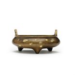 A large gold-splashed bronze tripod incense burner, ding Xuande six-character mark, 17th/18th cen...