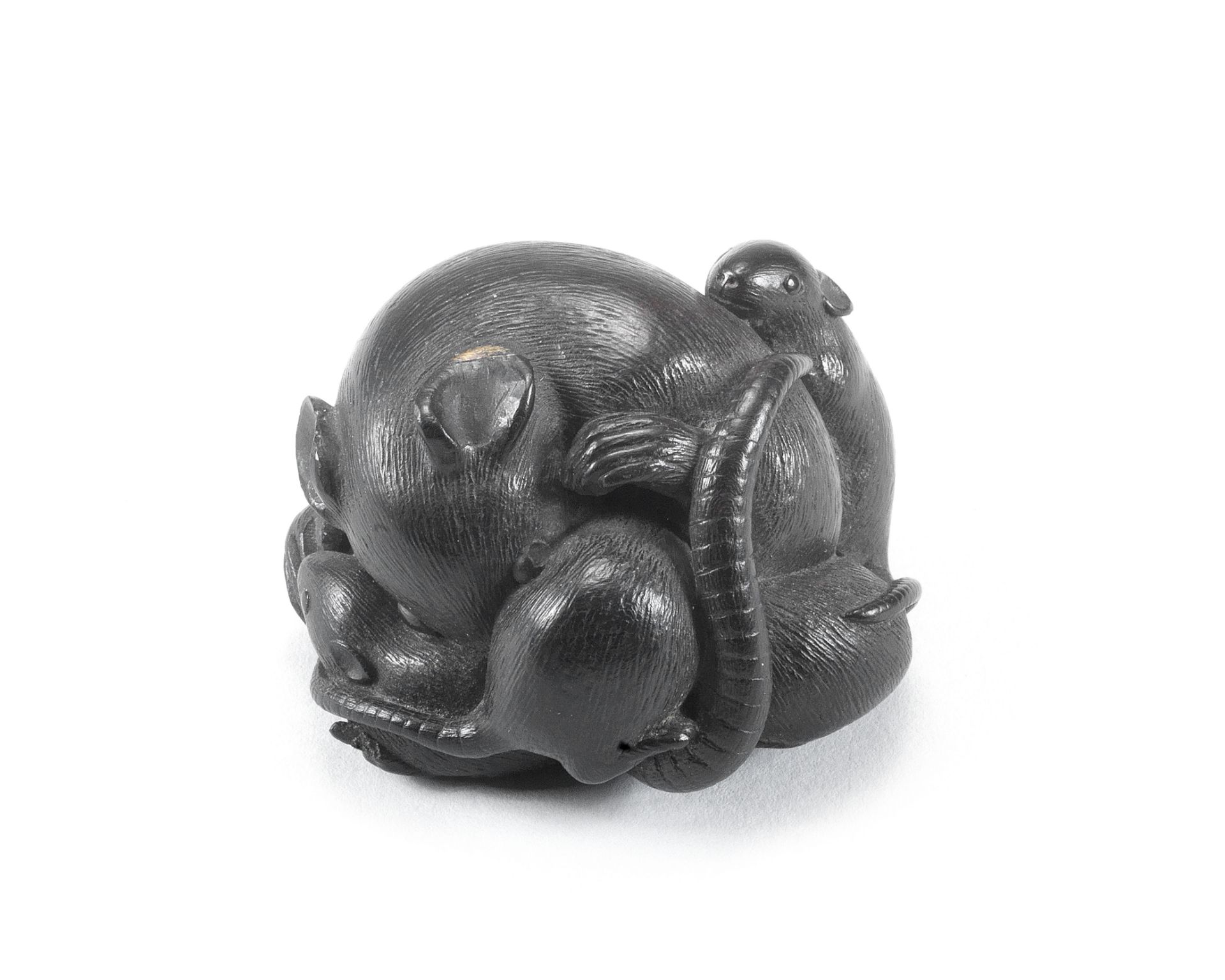 An ebony wood netsuke of a group of rats By Horaku, Kyoto, Edo period (1615-1868), 19th century