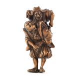 A wood netsuke of Omori Hikoshichi and Chihaya Edo period (1615-1868), late 18th/early 19th century