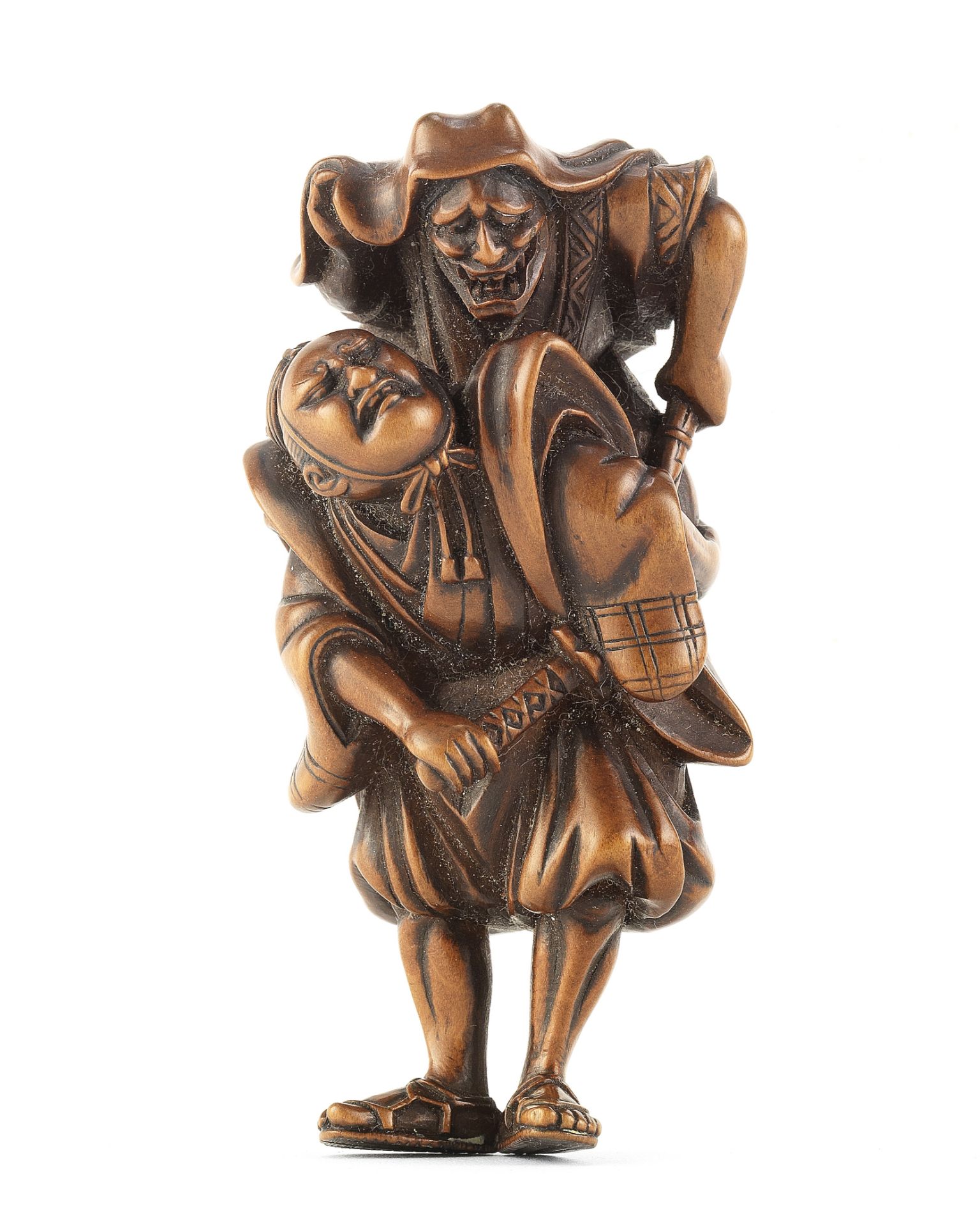 A wood netsuke of Omori Hikoshichi and Chihaya Edo period (1615-1868), late 18th/early 19th century