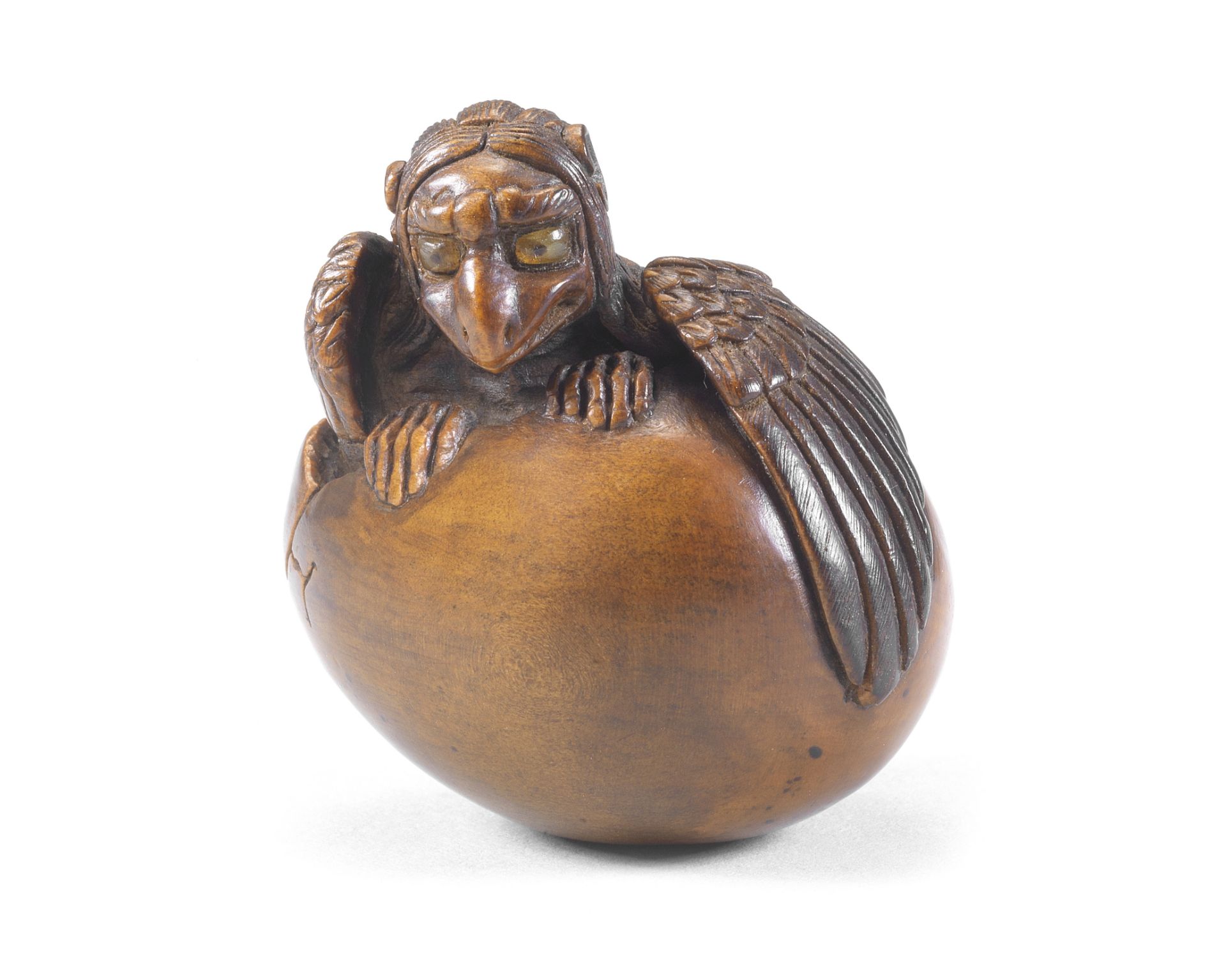 A wood netsuke of a tengu no tamago (hatching tengu) By Toyoyasu (Toyoyo, 1811-1883), Sasayama, T...