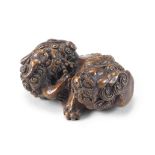 A bamboo netsuke group of two shishi (Chinese mythological lion dogs) Meiji era (1868-1912), late...