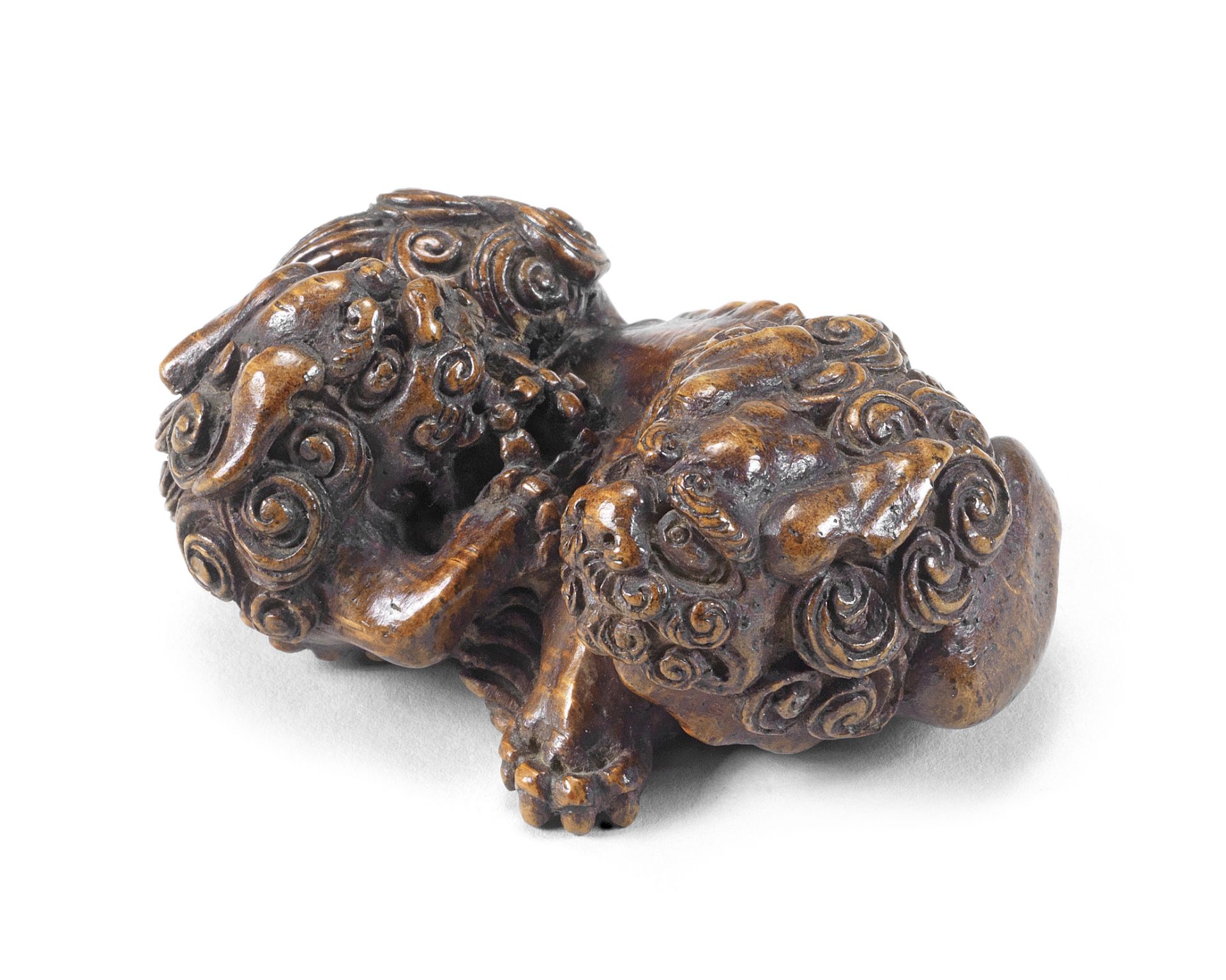 A bamboo netsuke group of two shishi (Chinese mythological lion dogs) Meiji era (1868-1912), late...