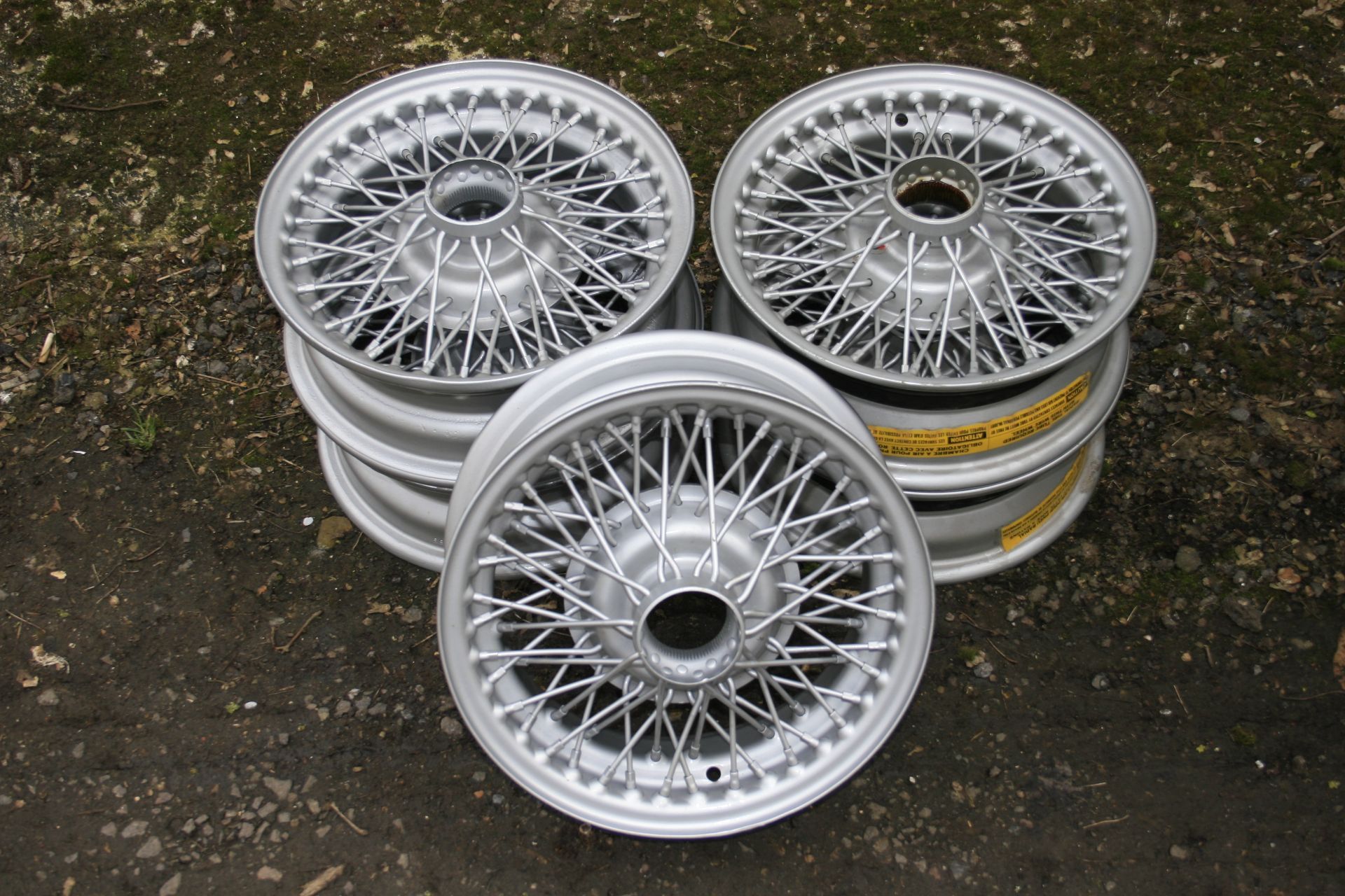 A set of five Dunlop 14&#189; inch diameter wire spoked wheels, ((5))