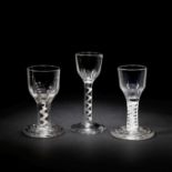 Two opaque twist firing glasses and an airtwist wine glass, circa 1755-65