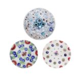 Two large Clichy patterned millefiori paperweights and an English weight, circa 1850 and later