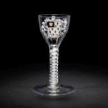 The Surtees Marriage glasses: a rare enamelled armorial wine glass from the Beilby workshop, circ...