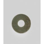 AN ARCHAIC GREEN AND RUSSET JADE DISC, BI Warring States Period/Han Dynasty