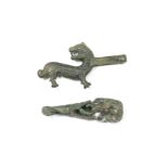 TWO RARE ARCHAIC BRONZE 'ZOOMORPHIC' BELT HOOKS The first Warring States/Han Dynasty; the second ...