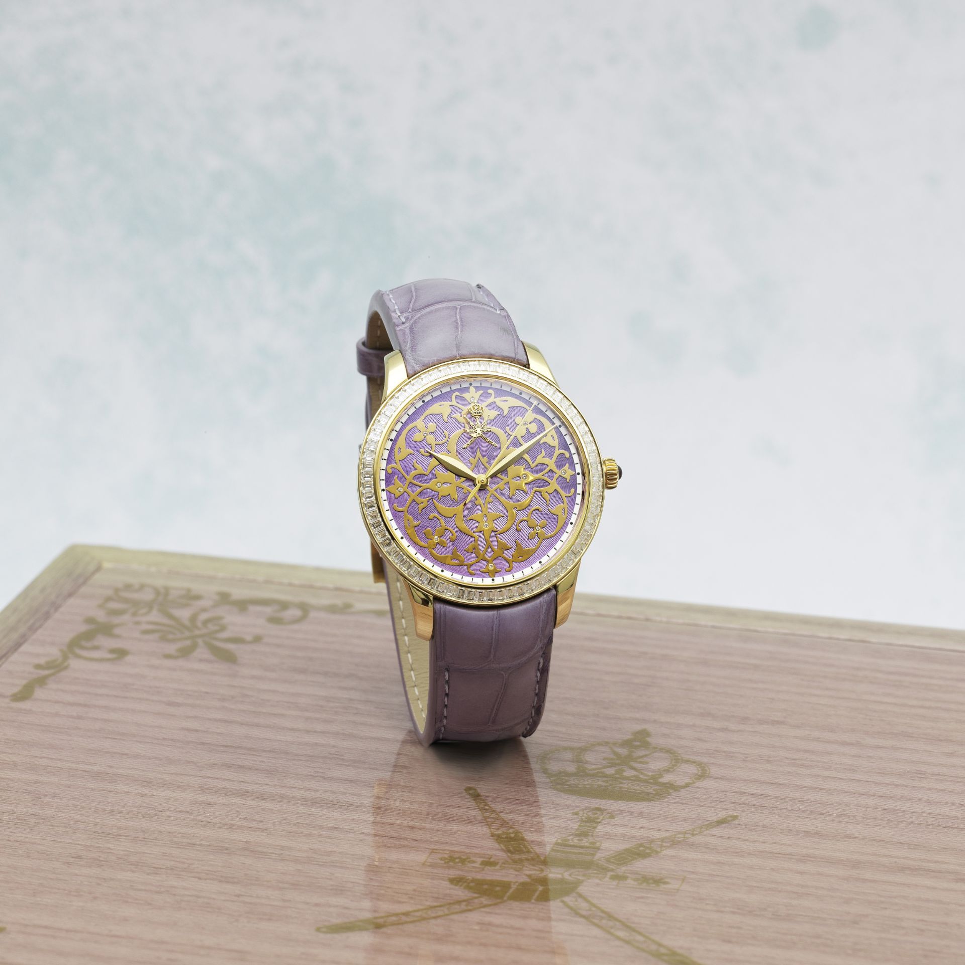 William & Son. An unusual 18K gold and diamond set automatic wristwatch with Khanjar emblem and e...