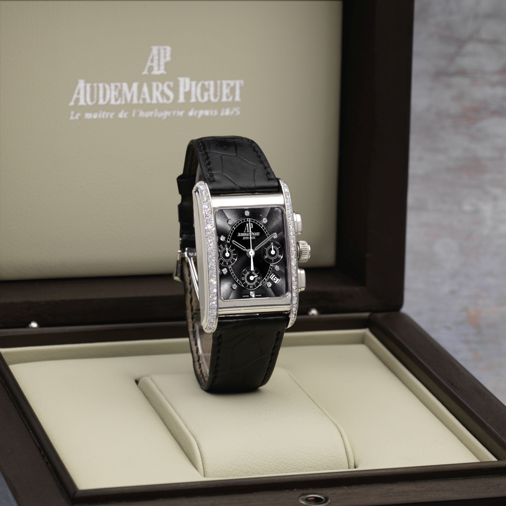 Audemars Piguet. An 18K white gold and diamond set automatic calendar chronograph wristwatch Ed...