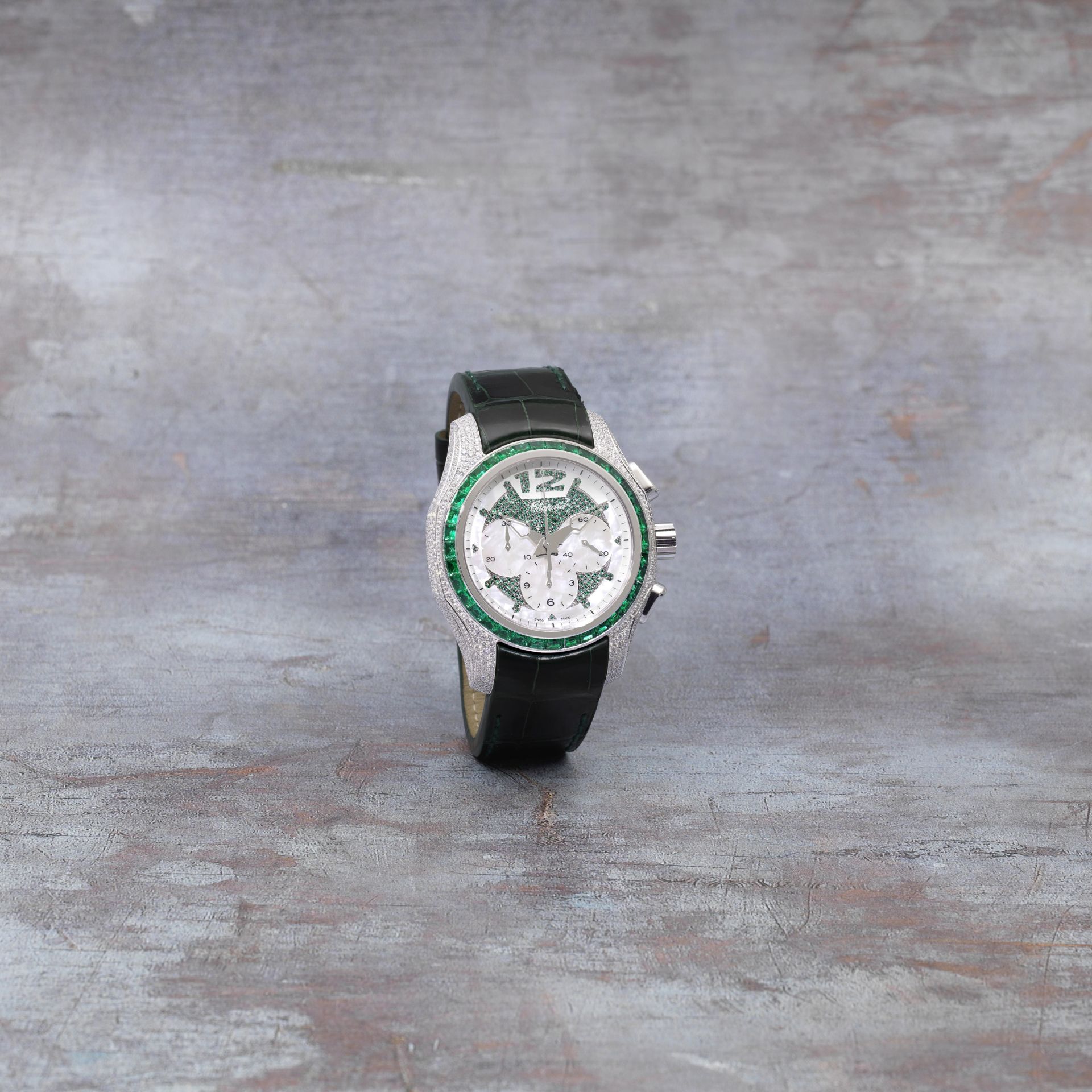 Chopard. A limited edition 18K white gold, emerald and diamond set automatic wristwatch Elton Jo...