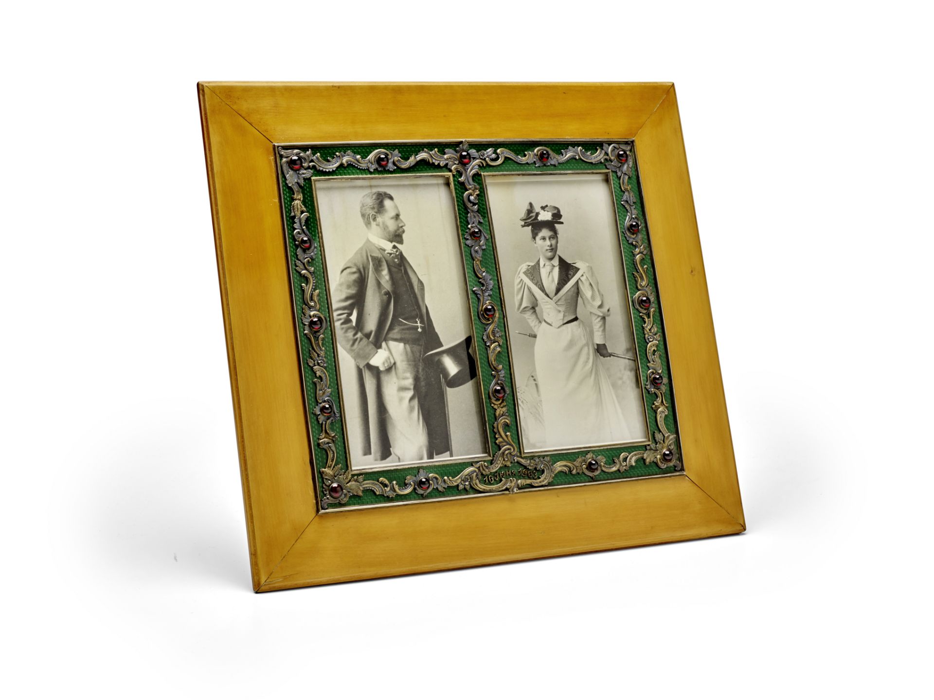 A large jewelled silver-gilt, enamel and wood double-photograph frame Faberg&#233;, workmaster Vi...