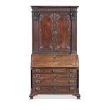 A George III carved mahogany and ormolu mounted bureau cabinet attributed to Gillows the carving...