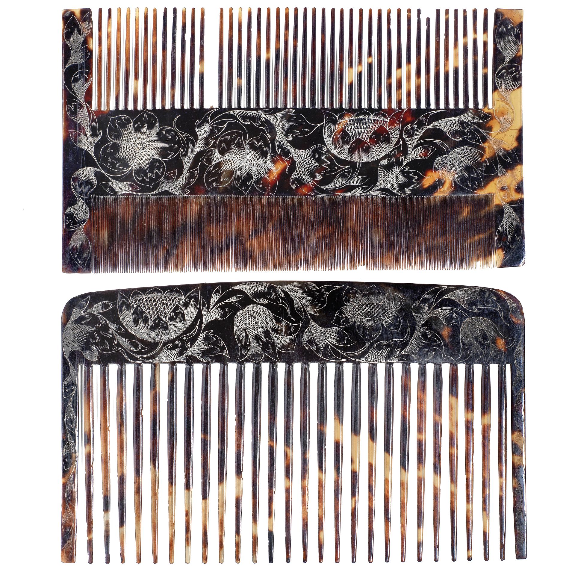 A rare late 17th century Jamaican colonial engraved tortoiseshell wig comb case containing two co...