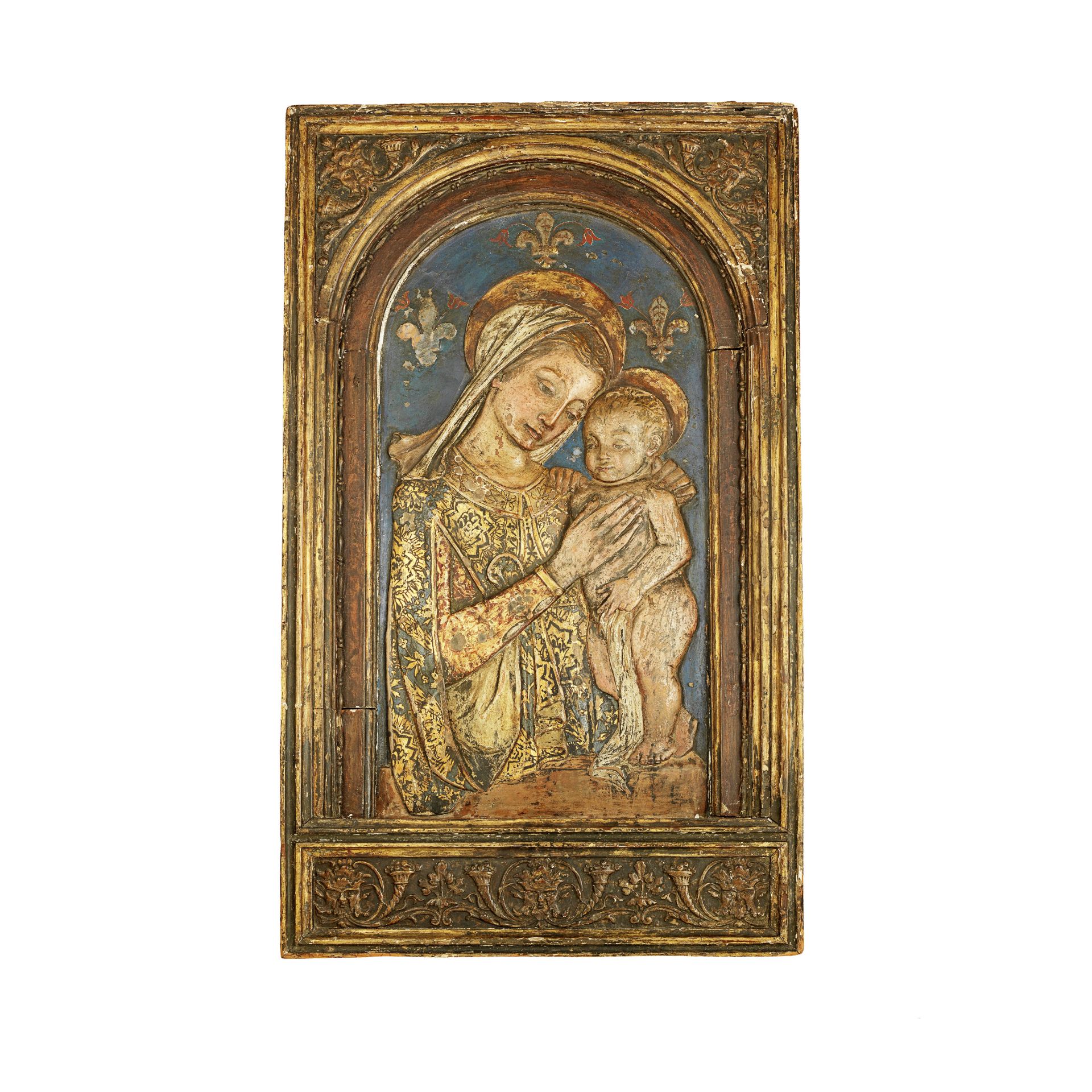 An Italian polychrome and gilt 'Cartapesta' arched figural relief of the Virgin and Christ Child ...