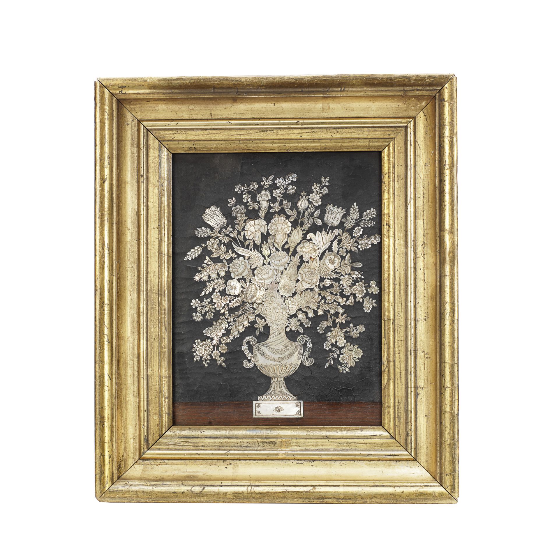 A rare Dutch mother of pearl inlaid panel depicting a vase of a garden flowers in the manner of D...